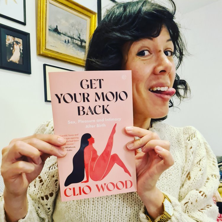 Clio wood holds a copy of her book 'Get your Mojo Back: Sex, Pleasure, and Intimacy After Birth'